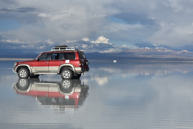 https://unsplash.com/photos/a-red-truck-on-a-lake-Xk6U4f3HRpw